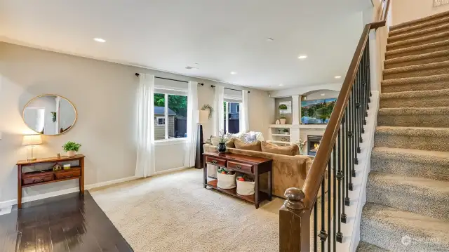 Upstairs leads to the bedrooms and bonus room.