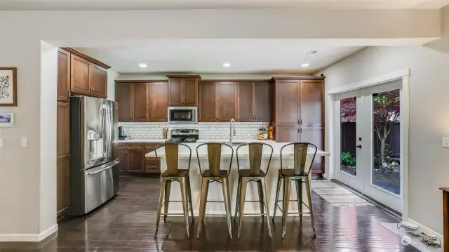Kitchen features large island with plenty of room for seating.
