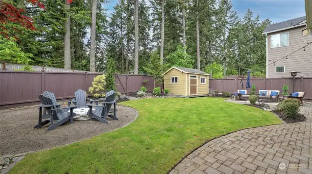 The well-designed backyard offers a perfect blend of functionality and recreation.