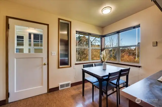 Kitchen door leads to a mudroom and out to the side yard.