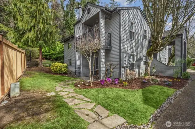 Exterior view with stone walkway to patio