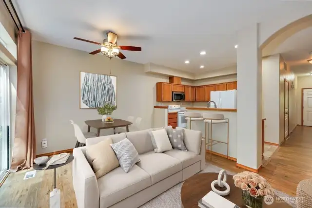 Digitally staged living room and dining area.