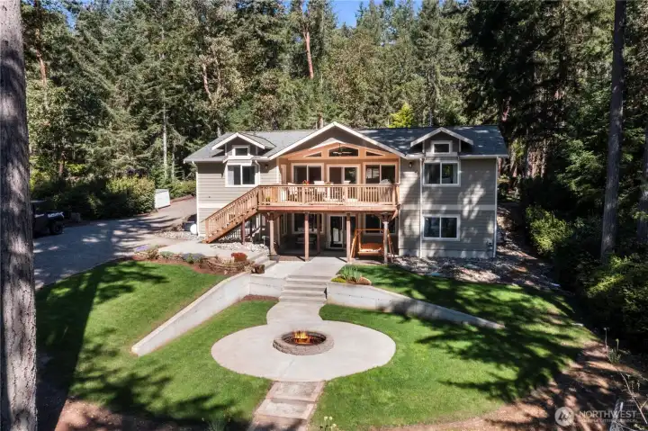 A handsome home surrounded by gorgeous hardscaping and mature landscaping!