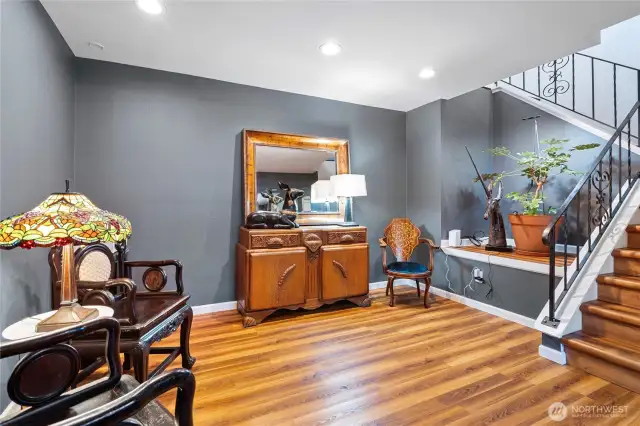 Downstairs living area with access to covered patio and backyard