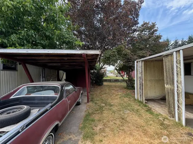 parking space and carport with shed, vehicles have been removed