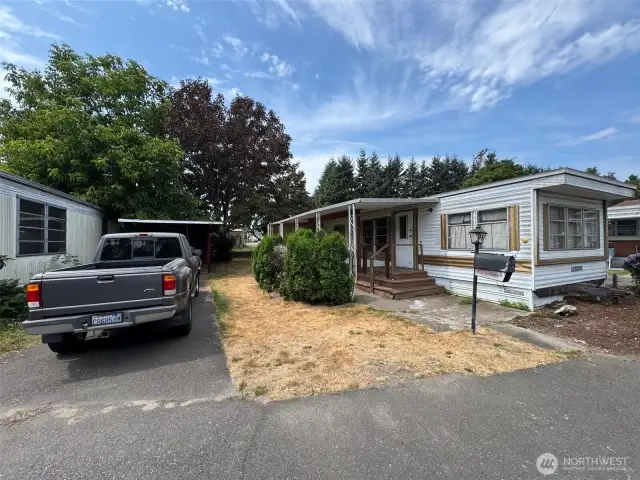 parking space and carport with shed, vehicles have been removed