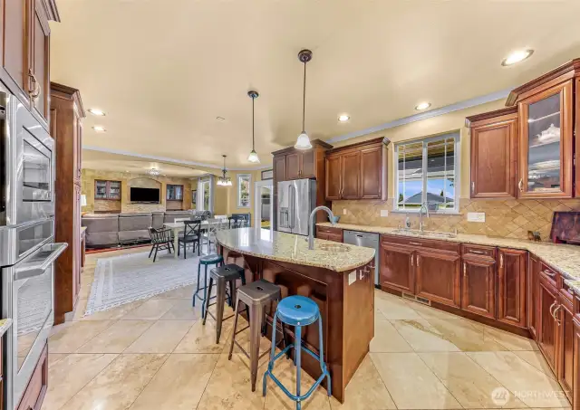 Kitchen opens to the informal dining area and a family room