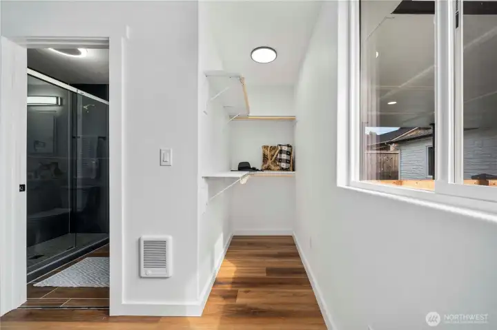 Primary bedroom walk-in closet and bathroom