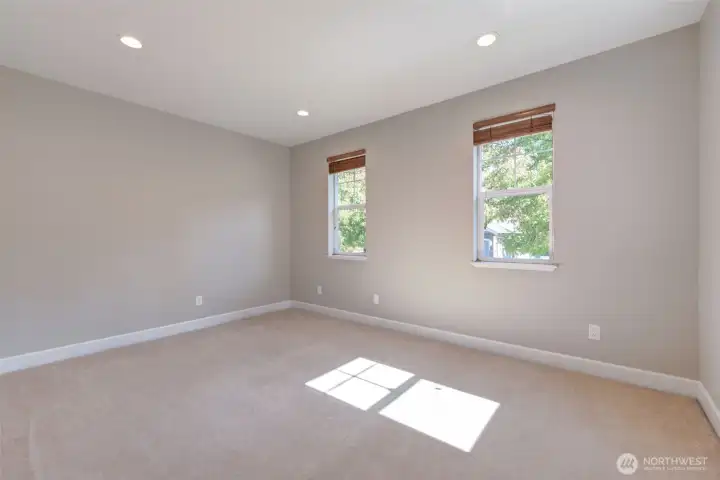 “Spacious main-level den with east-facing windows. Flexible design works perfectly as a home office or a 5th bedroom—ideal for guests or multigenerational living.”