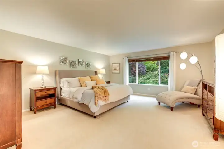“Expansive primary suite set apart on its own side of the home, creating a private retreat.”