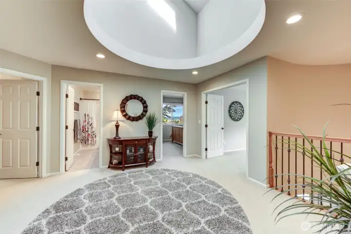 “Expansive loft leads to the oversized family room—an ideal space for gathering, relaxing, or play.”
