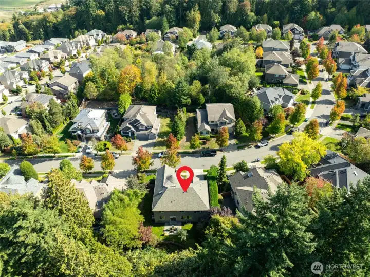 “Stunning aerial view shows this East-facing home perched in a prime position, highlighting its presence and setting as one of the best in the neighborhood.”