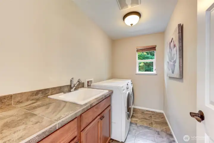 Upstairs laundry with sink!