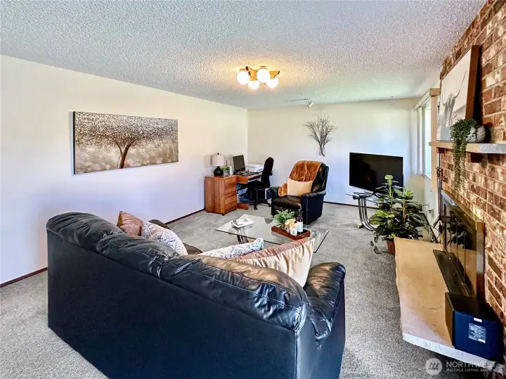 Another view of the family room...notice all the wall space making it perfect for your large flat screen TV.