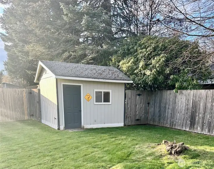 Close up view of one of two storage sheds on in the backyard.