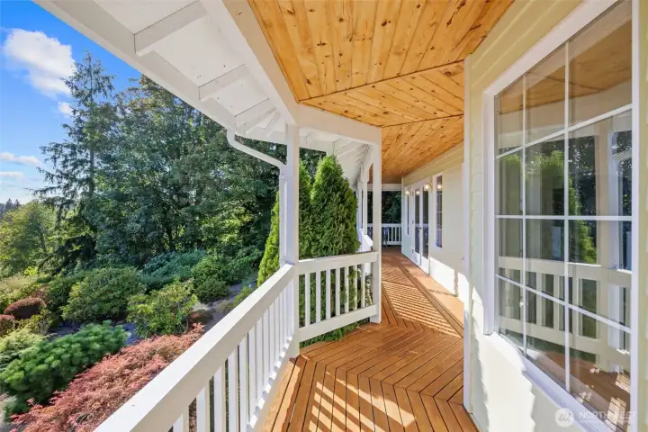 Deck off living and dining with views of the yard and sound.