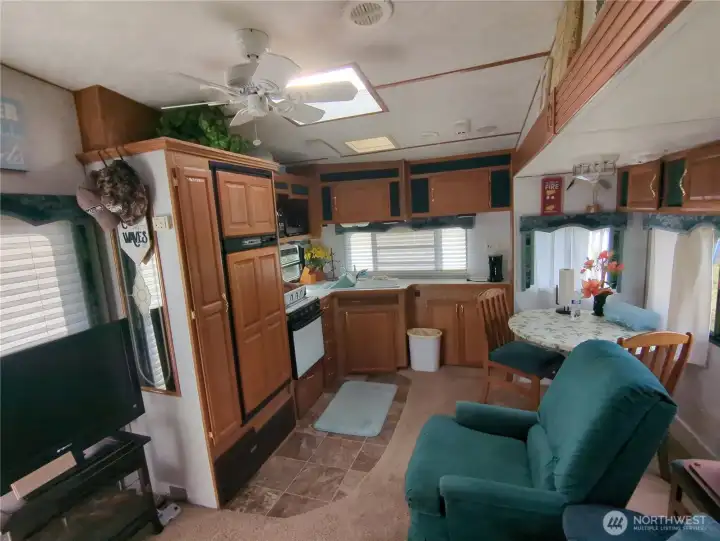 Kitchen offers stove, large refrigerator, sink, pantry and plenty of cupboard space.