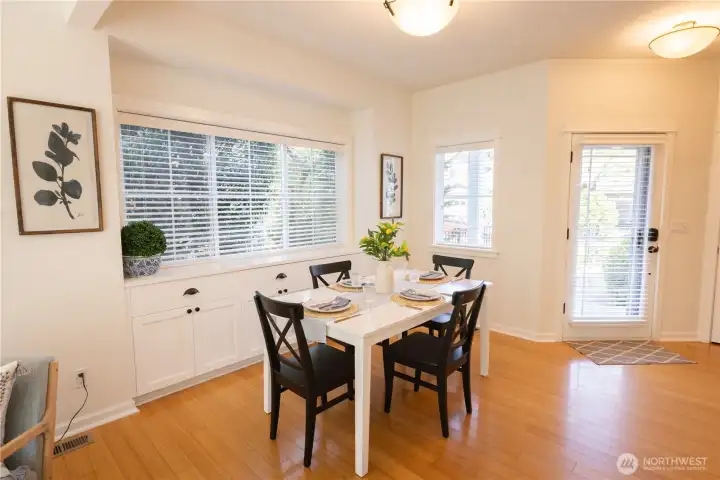 Beautiful front door entry, surrounded by glass doors, windows and natural light, with lovely flooring, plus a great dining room with built-ins for displays and providing plenty of storage locations.