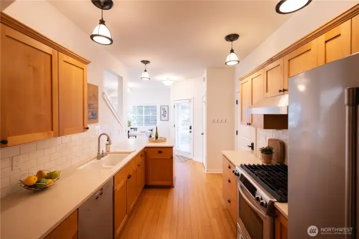 Kitchen includes lots of nice cabinets, lots of counter space, all stainless appliances with a propane stove, and an eat-in kitchen location.