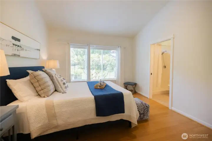 Freshly painted through out this lovely light filled home with a spacious main floor primary bedroom, an en-suite bathroom and a walk-in closet.