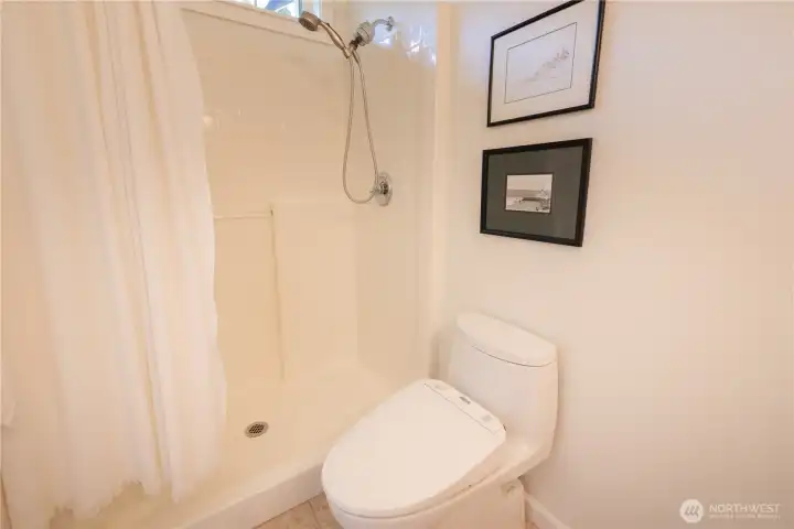 Primary en-suite bathroom with shower.