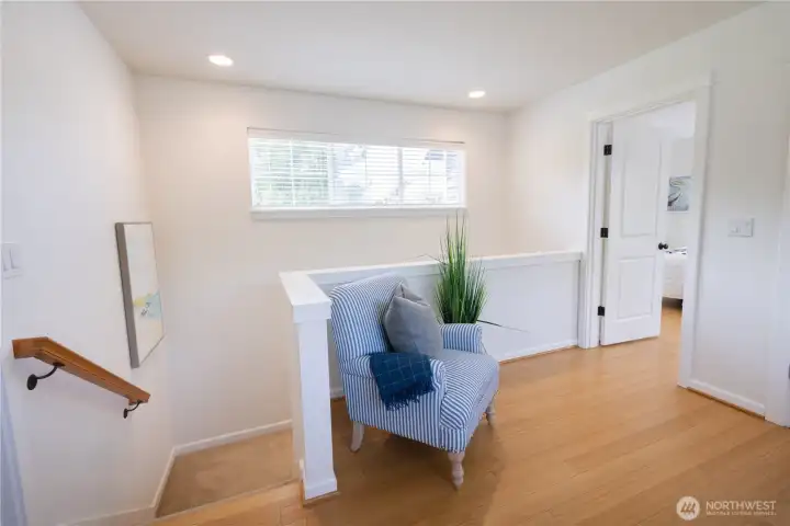 At the top of the stairs on the second floor is very nice open space office-den or library with built-in book cases, closet storage, and beautiful flooring.