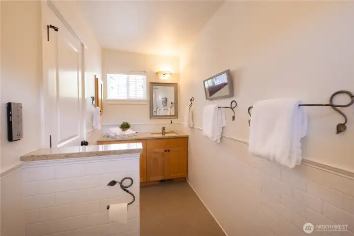 Upper floor full bathroom with tub and shower combination.