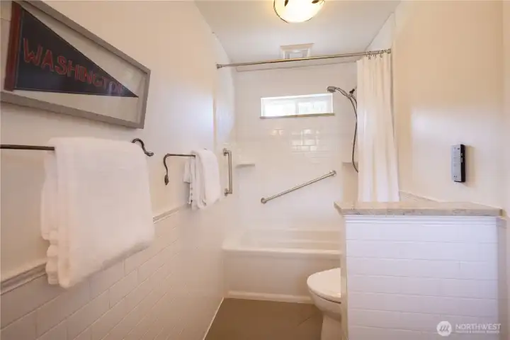 Great size full bathroom with tub and shower combination.