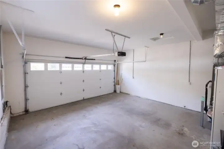 Great attached 2-Car Garage with storage cabinets.