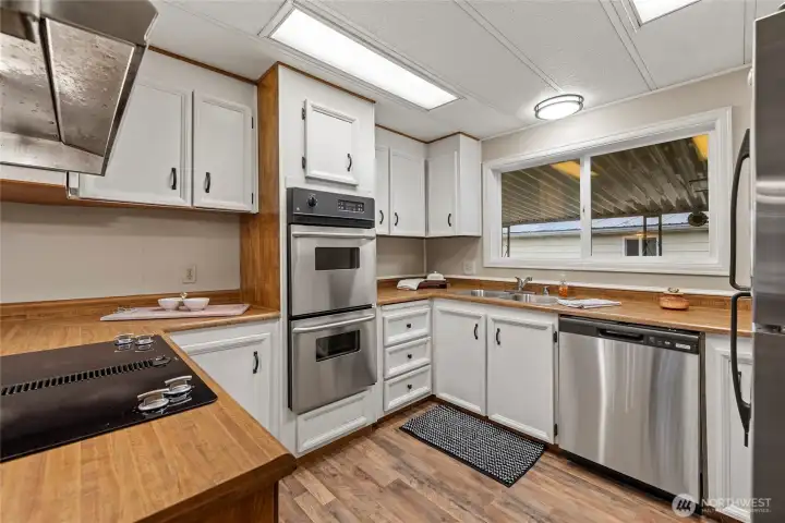 Updated Kitchen with all SS Appliances. Brand new Dishwasher and Refrigerator. Updated newer Double ovens and glass cooktop.