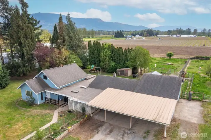Not only is there a 3 bed/1.75 bath home, there is an office with a 1/2 bath/ a garage with a service pit, 5 stalls with runs, 3 turn out pastures all on 1.43 acres!