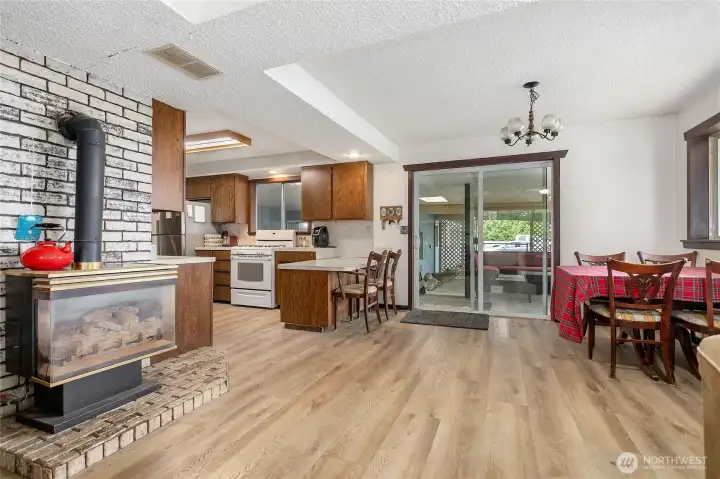 Open flow from living room to dining area, kitchen and covered patio.