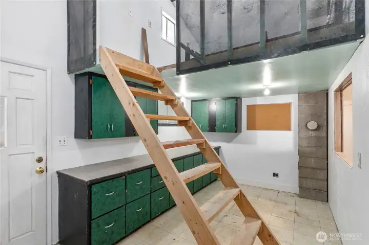 From the patio there is an office space (potential ADU) that has a kitchen space with room for stove and fridge + a loft.