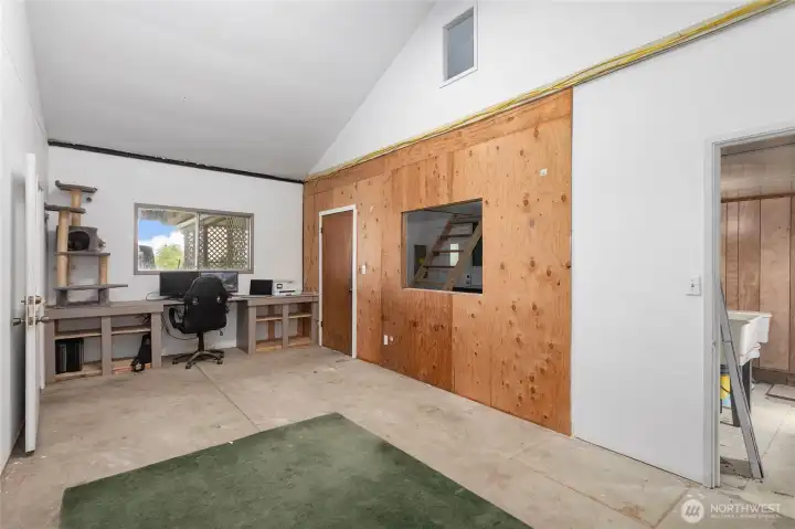 Office space with bathroom to right in photo.