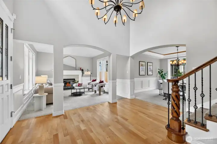 Open formal entry with grand staircase to  2nd level.