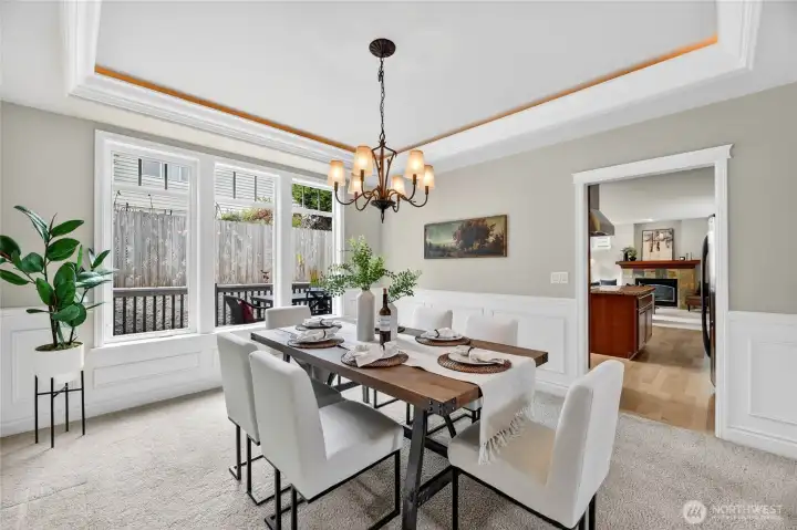 Formal  dining with recessed lighting and gorgeous wainscoting details,