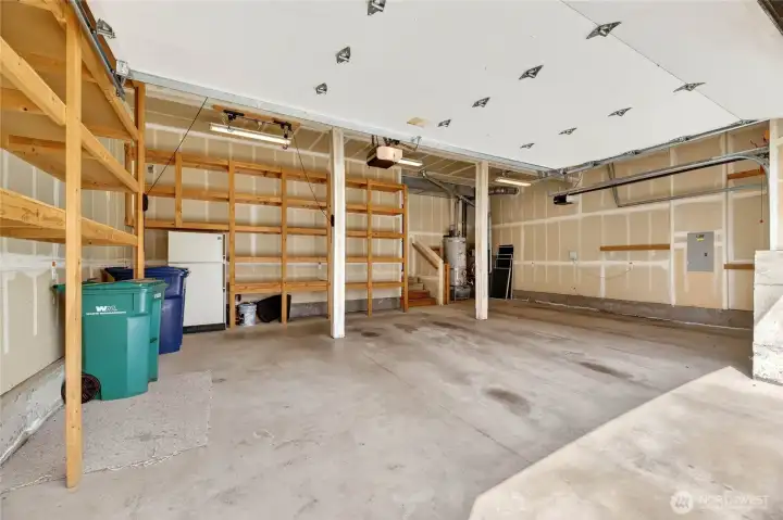 Huge 3 car garage with custom built in storage and ceiling bike racks.
