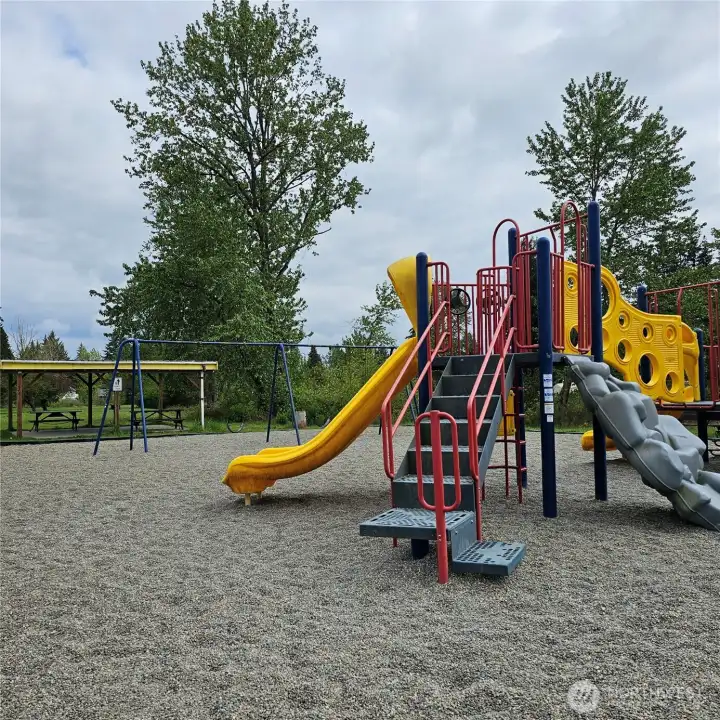 One of the playgrounds with a picnic area.