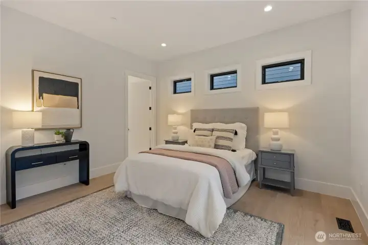 Main floor guest bedroom with ensuite bath
