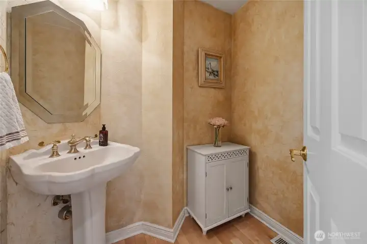 Half bath on the main level offers convenience for guests