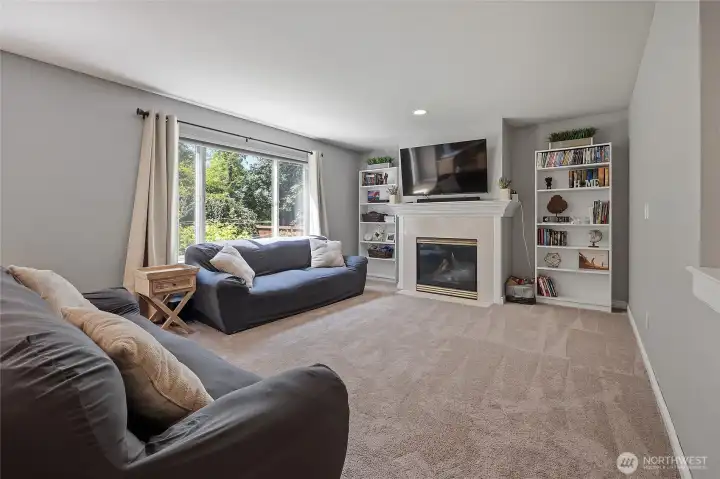 Family room located off the kitchen and perfect to watch the game while preparing meals