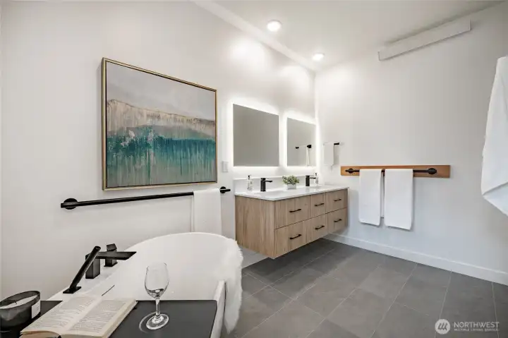 The royal primary ensuite with double vanity, dimmable mirror and ceiling lights setting the perfect ambiance. The royal primary ensuite with double vanity, dimmable mirror and ceiling lights setting the perfect ambiance.