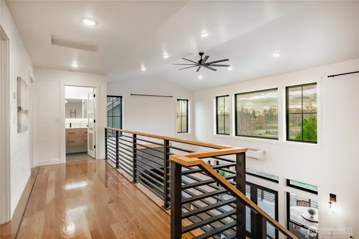 Custom White Oak hardwood floor with Walnut border throughout second level (tile flooring in bath). Custom White Oak hardwood floor with Walnut border throughout second level (tile flooring in bath).