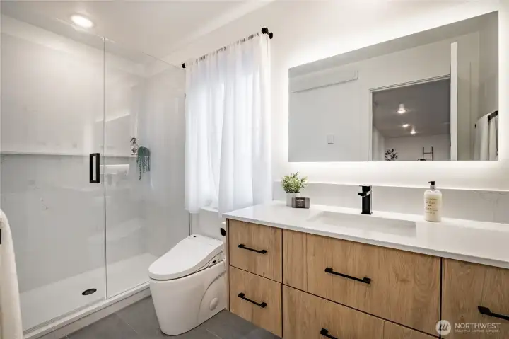 3/4 bathroom on second level. Each bathroom offers heated bidets and dimmer lighting including vanity mirror. 3/4 bathroom on second level. Each bathroom offers heated bidets and dimmer lighting including vanity mirror.