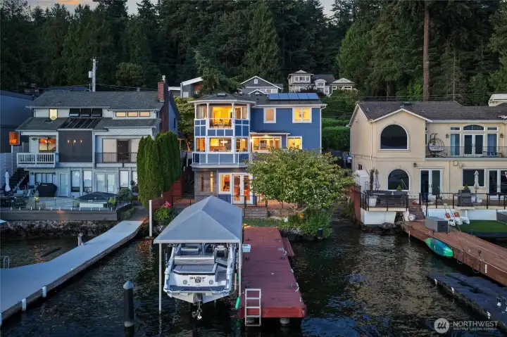 Rare opportunity to enjoy the ultimate Lake Washington waterfront lifestyle from this exceptional west-facing retreat in coveted Holmes Point.