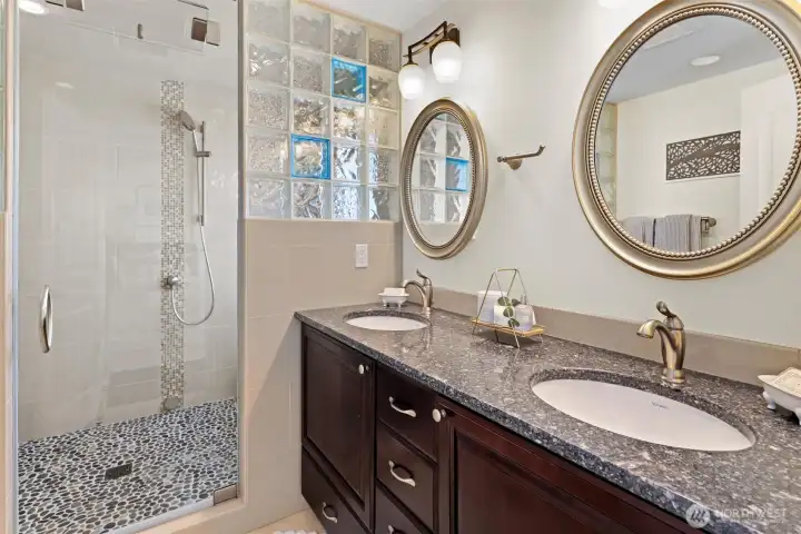 Primary spa-inspired bath with steam shower and dual vanity
