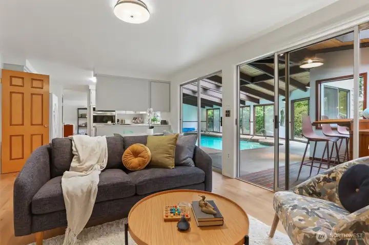 Family room open to the kitchen and indoor pool. Family room open to the kitchen and indoor pool.