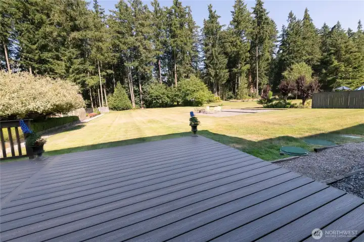 Beautiful mature trees line the back of the almost 3/4 acre lot