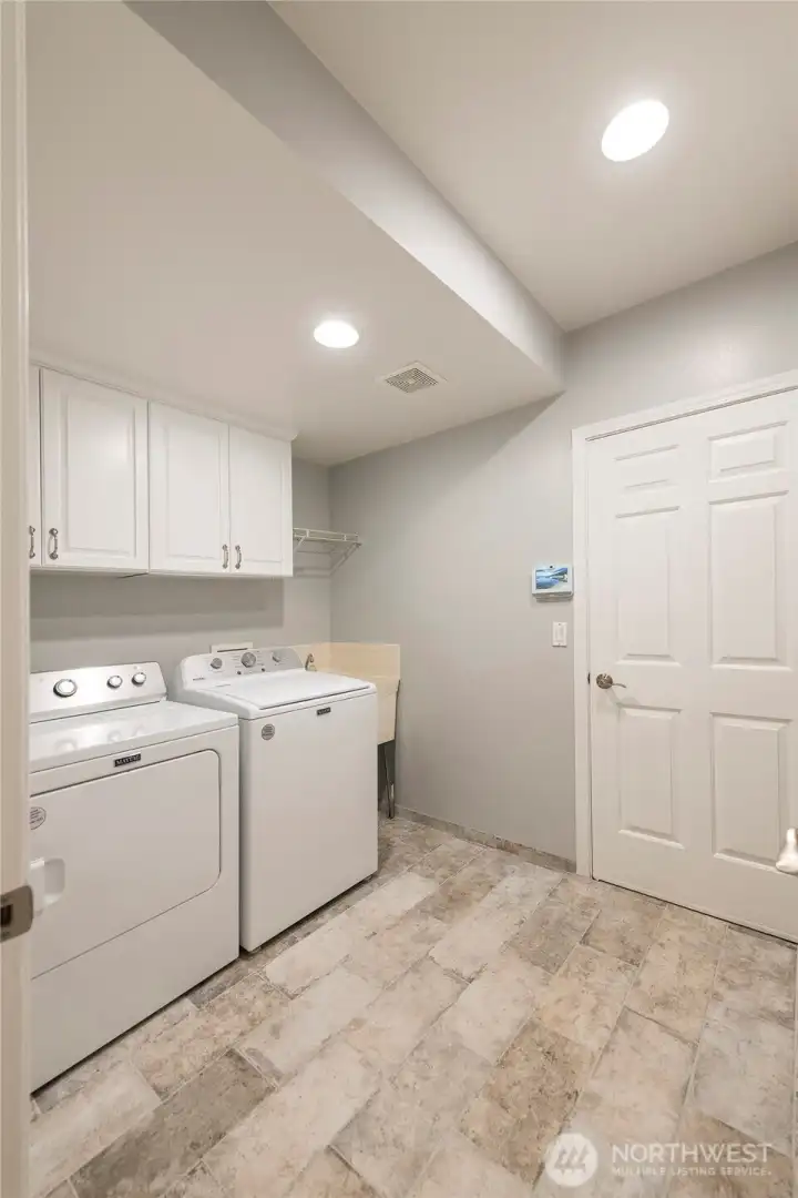 Laundry room leads to the garage and washer / dryer stays