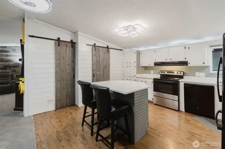 Spacious kitchen includes custom barn doors with a broom closet and a massive pantry. Spacious kitchen includes custom barn doors with a broom closet and a massive pantry.